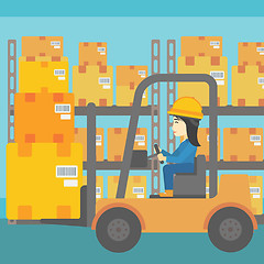 Image showing Warehouse worker moving load by forklift truck.