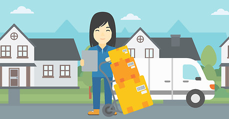 Image showing Delivery woman with cardboard boxes.