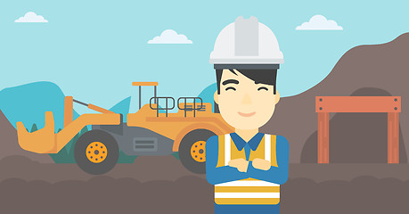 Image showing Miner with mining equipment on background.