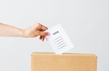 Image showing man putting his vote into ballot box on election