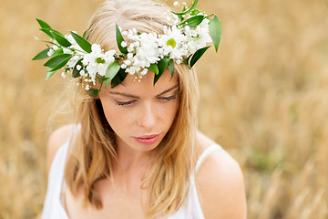 Image showing happy woman in wreath of flowers