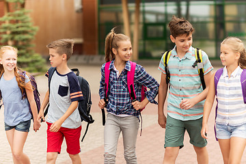 Image showing group of happy elementary school students walking