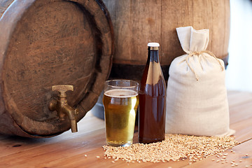 Image showing close up of beer barrel, glass, bottle and malt