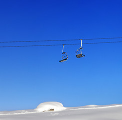 Image showing Chair-lift and blue clear sky at sunny day
