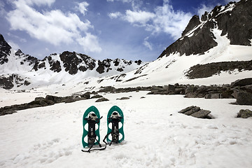 Image showing Snowshoes in snow mountain