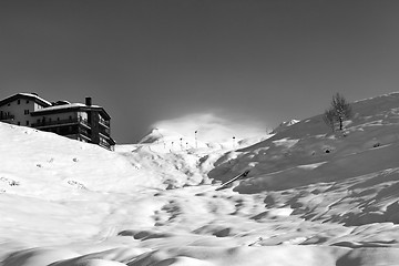 Image showing Black and white view on off-piste slope and hotel in winter moun