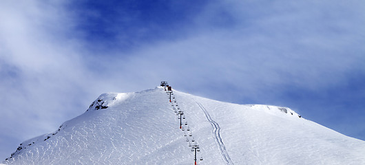 Image showing Panoramic view on ski slope and chair-lift.