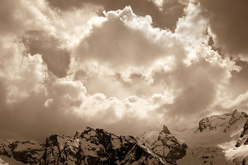 Image showing Winter mountain in sunlight clouds