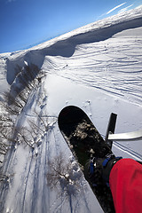 Image showing Snowboard over off-piste slope in sun day