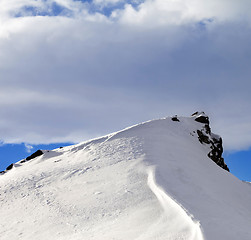 Image showing Top of mountains with snow cornice after snowfall