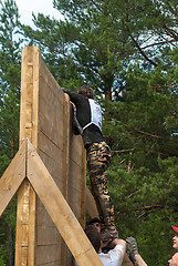 Image showing Sportsmen storm wall in extrim race. Tyumen