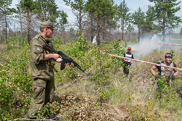 Image showing Athletes run on a ravine in extrim race. Tyumen