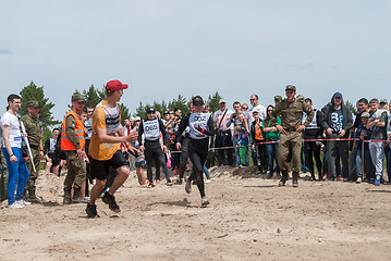 Image showing Sportsmen run on last stage in extrim race.Tyumen