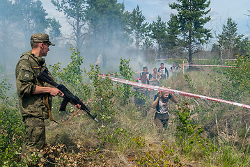 Image showing Athletes run on a ravine in extrim race. Tyumen