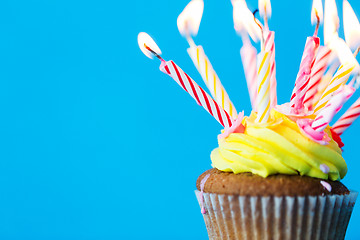 Image showing birthday cupcake with many burning candles