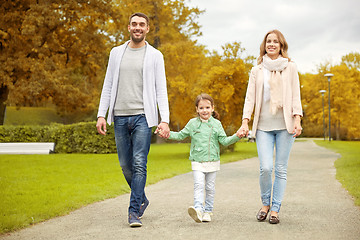 Image showing happy family walking in autumn park