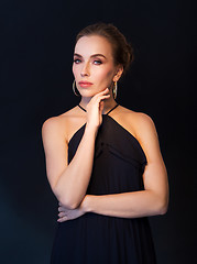 Image showing beautiful woman in black wearing diamond jewelry