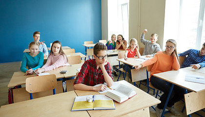 Image showing classmates laughing at student boy in school