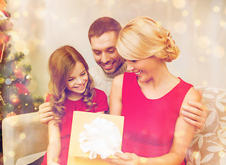 Image showing happy family opening gift box