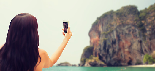 Image showing young woman taking selfie with smartphone