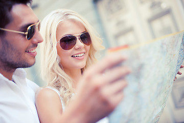 Image showing couple with map in the city