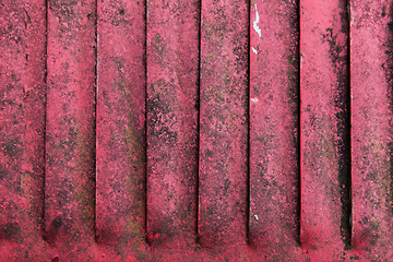 Image showing close up of old red rusty metal flaps