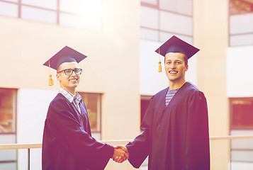 Image showing smiling students in mortarboards