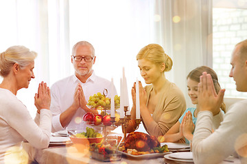 Image showing smiling family having holiday dinner at home