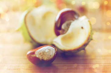 Image showing close up of chestnut on wooden table