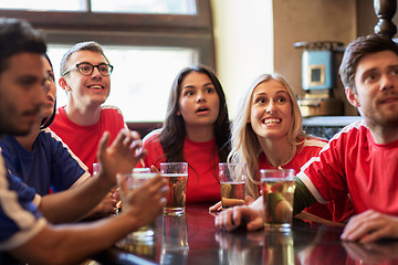 Image showing fans or friends watching football at sport bar