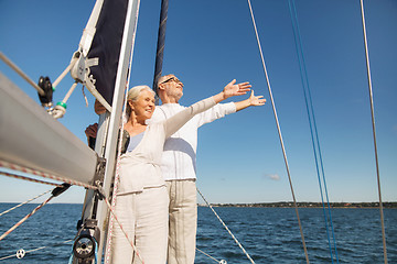 Image showing senior couple hugging on sail boat or yacht in sea