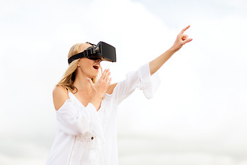 Image showing woman in virtual reality headset pointing finger