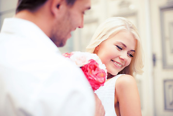 Image showing couple with flowers in the city