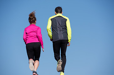 Image showing young  couple jogging on steps