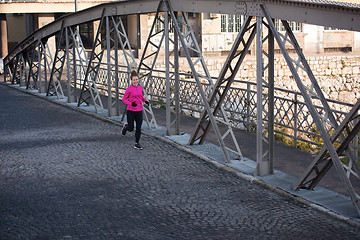 Image showing sporty woman jogging on morning