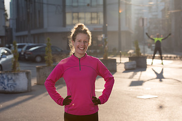 Image showing woman  stretching before morning jogging