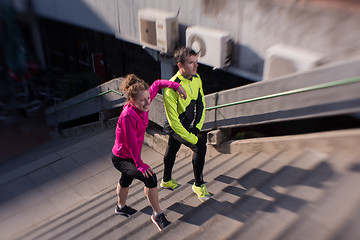 Image showing young  couple jogging on steps