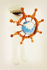 Image showing Sailor with wood steering wheel and earth. Trip around the world