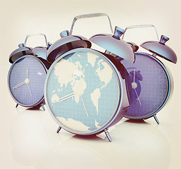 Image showing Alarm clock of world map and alarm clocks. 3D illustration. Vint