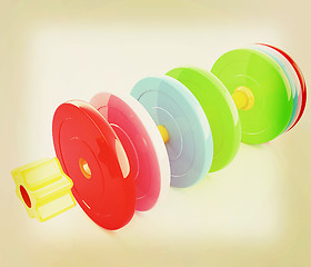 Image showing Colorful dumbbells are assembly and disassembly on a white backg