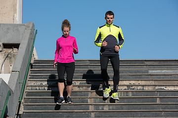 Image showing young  couple jogging on steps