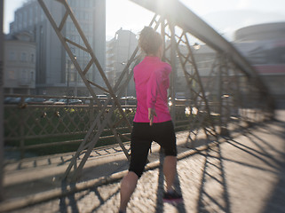 Image showing sporty woman jogging on morning