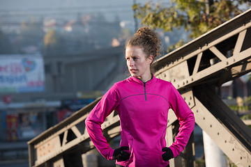 Image showing woman  stretching before morning jogging