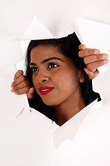 Image showing Woman looking through a paper howl.