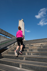 Image showing young  couple jogging on steps