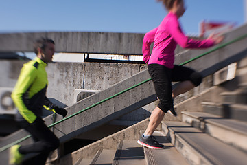 Image showing young  couple jogging on steps