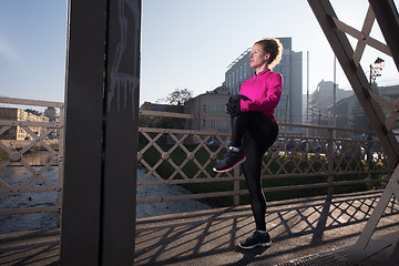 Image showing woman  stretching before morning jogging