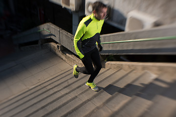 Image showing man jogging on steps