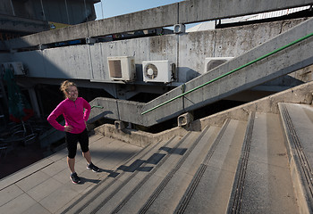 Image showing woman jogging on  steps