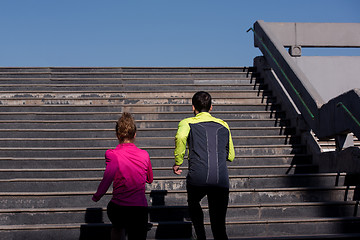 Image showing young  couple jogging on steps